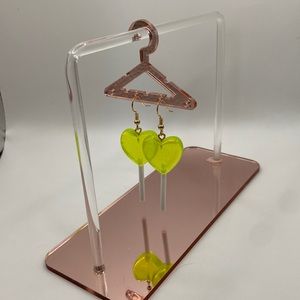 Bright neon green lollipop earrings.